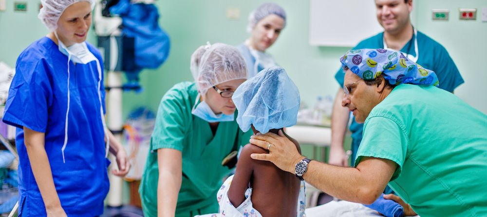Doctors tending to child