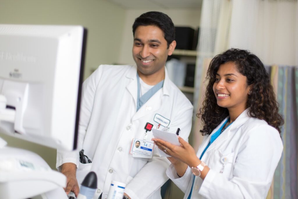 Featured image for Artificial Intelligence in Medicine blog. Shows St. George's University School of Medicine students photographed during their clinical rotations at The Brooklyn Hospital Center.