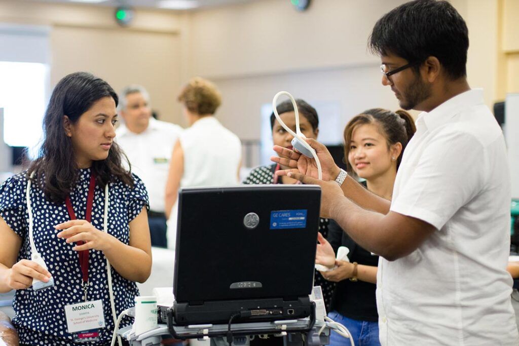 Medical students learning to use an ultrasound machine during SGU’s 7-Year MD Program.