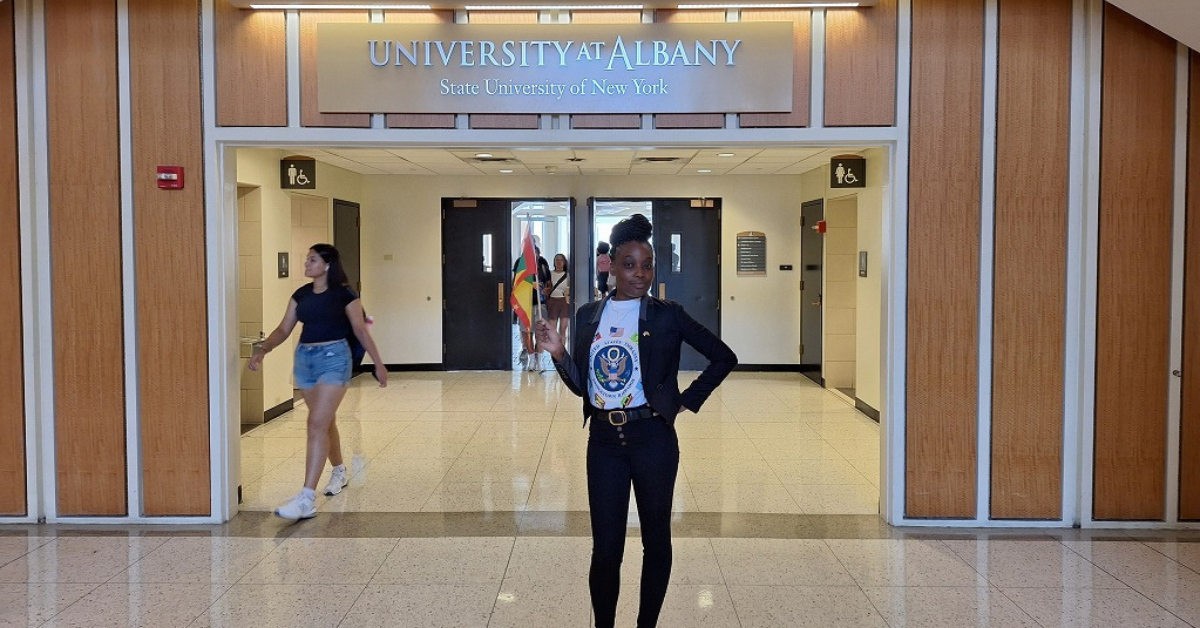 Alanda Joseph standing in front of "University at Albany sign"|Alanda Joseph standing in front of "University at Albany sign" News