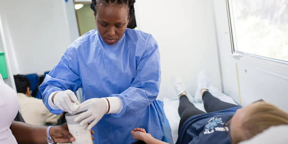Student prepping child for bloodwork