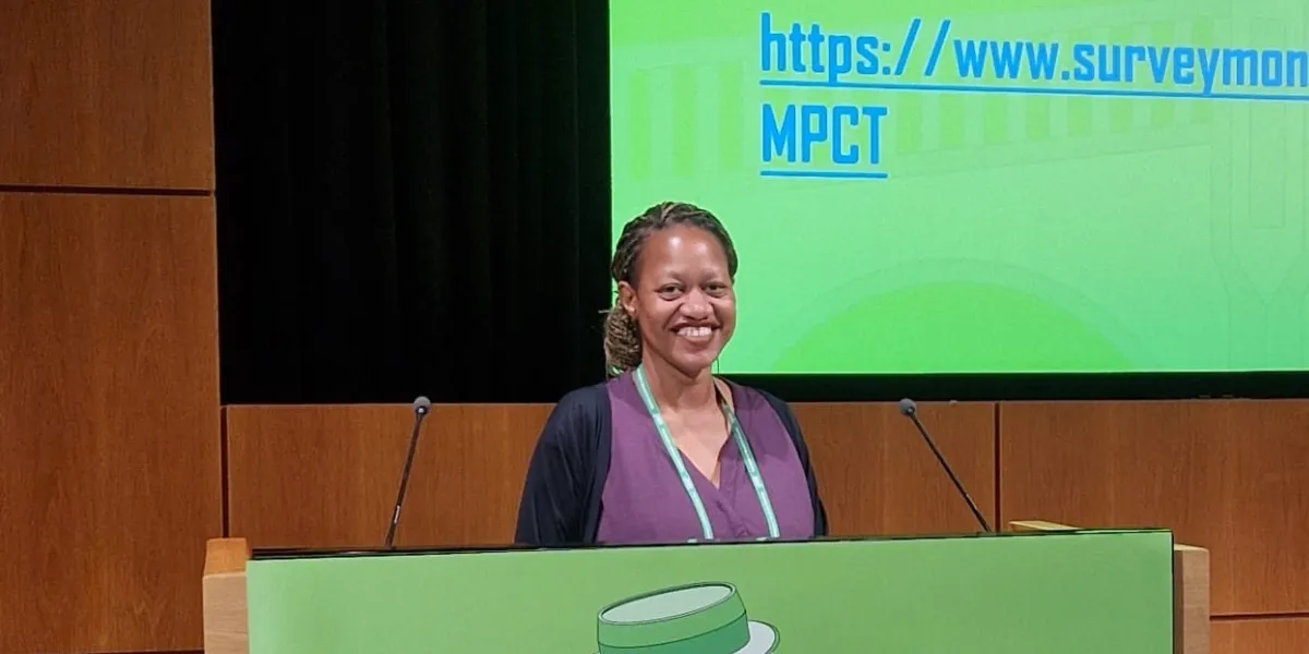 Dr. Duduzile Musa at a speaking engagement behind a podium