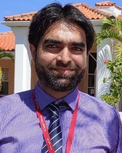 Firdous Ahmad Khan - Man in purple shirt with tie