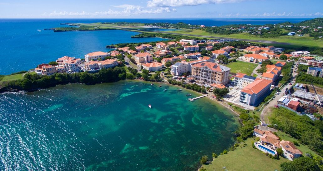 Panoramic view of the lush, mountainous island landscape and turquoise Caribbean Sea surrounding Grenada News