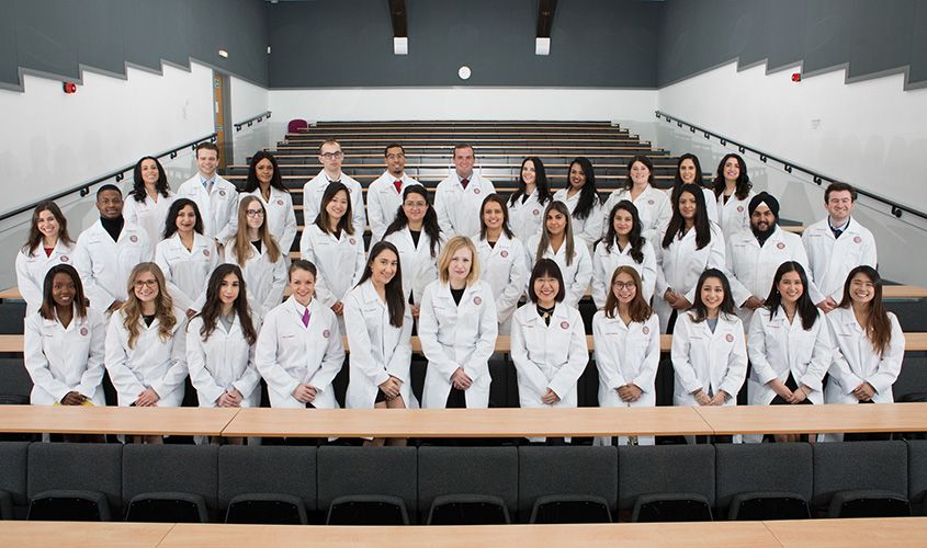 SGU medical students receiving their white coats at the Keith B. Taylor Global Scholars Program White Coat Ceremony, marking the start of their journey. News
