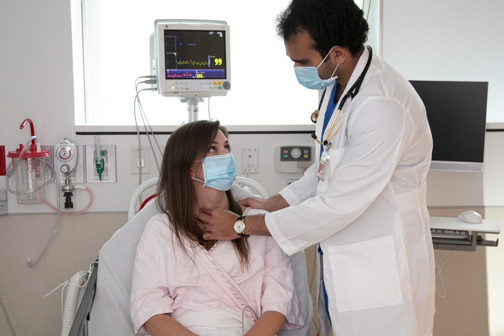 SGU graduate with patient