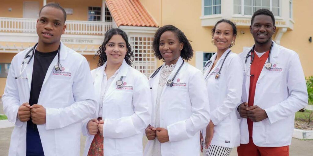SGU students in white coats