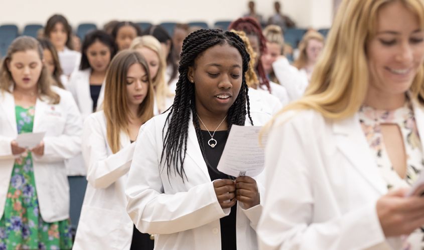 After donning their white coats, the ceremony came to a close with the students and other veterinarians in the hall reciting an oath of commitment to uphold the highest ethical standards and professionalism.