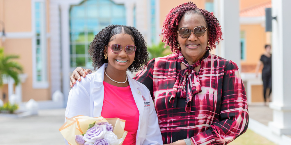Term 1 SOM student, Symiah Grey and her mentor, Dr. Deborah-Ann Stephens-John at Spring 2026 SOM White Coat Ceremony