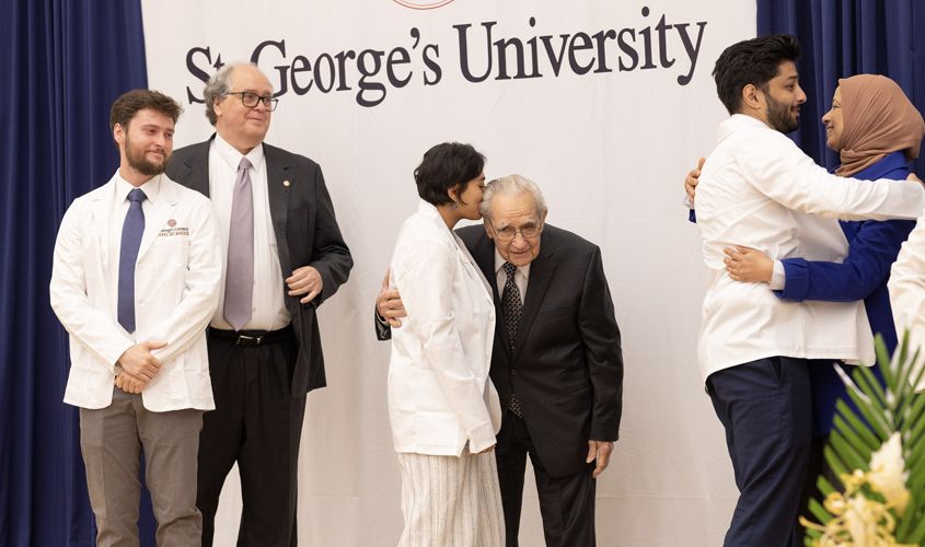 Also sharing a moment on stage was SOM Term 1 student, Carlie Hanlon who had the privilege of being coated by her grandfather, Dr. Robert Hanlon—a retired physician who practiced internal medicine and cardiology. The New Jersey native praised his granddaughter, confident that she will make a wonderful physician. 