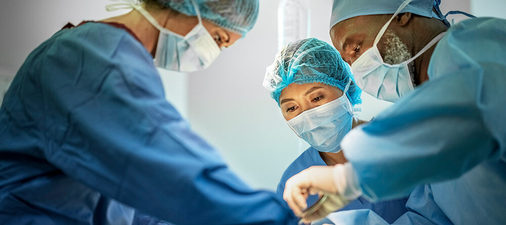 Group of physician performing orthopedic surgery