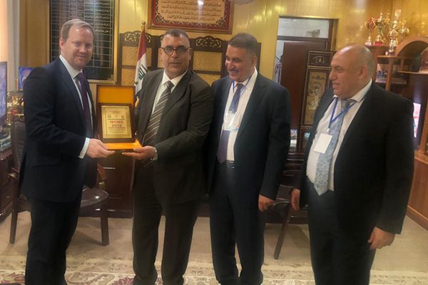 SGU and NU faculty members presenting the ICMS 2019 academic award plaque to commemorate their partnership in Iraq News