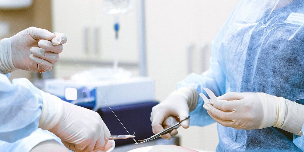 Physician performing orthopedic surgery