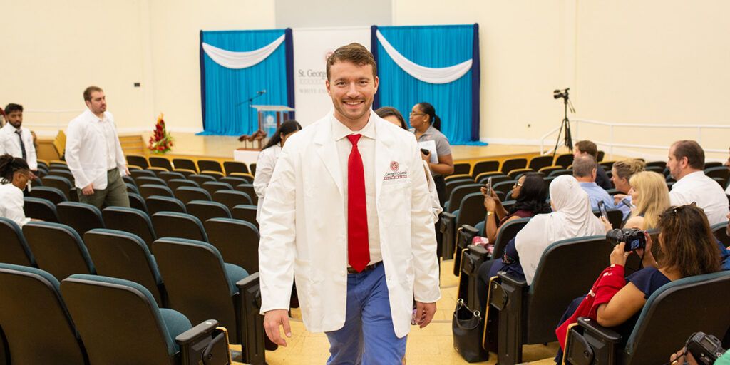 Student walking after earning white coat