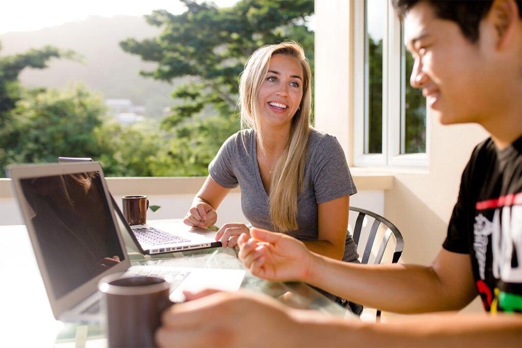 Undergraduate and graduate students at St. George’s University reviewing financial aid and scholarship resources.