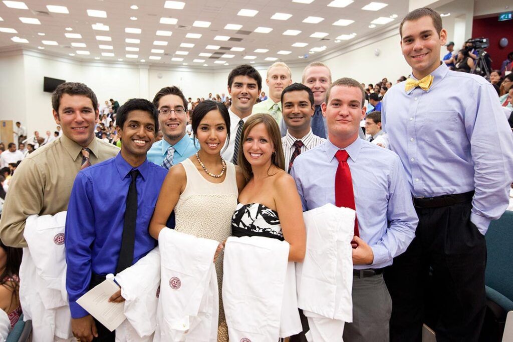 Friends of St. George’s University students at the White Coat Ceremony celebrating together.