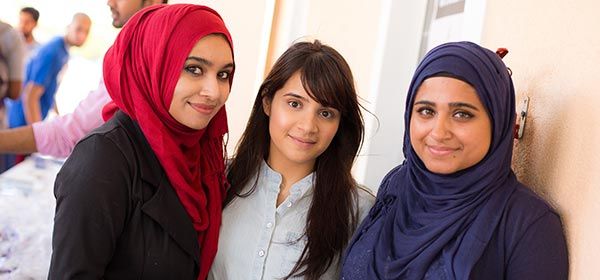 St. George’s University students smiling together on campus.