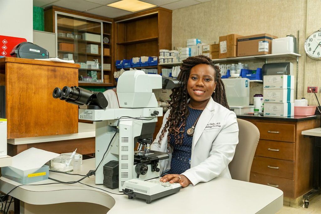 SGU student with microscope
