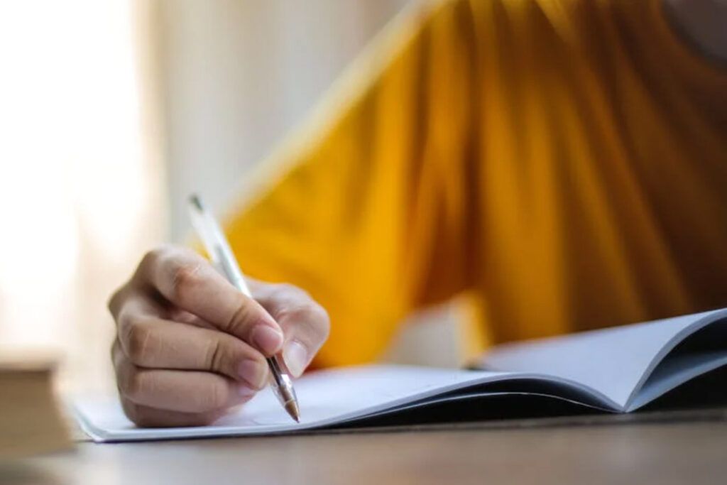 Student taking notes