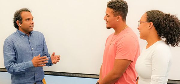 SGU Teacher with Students