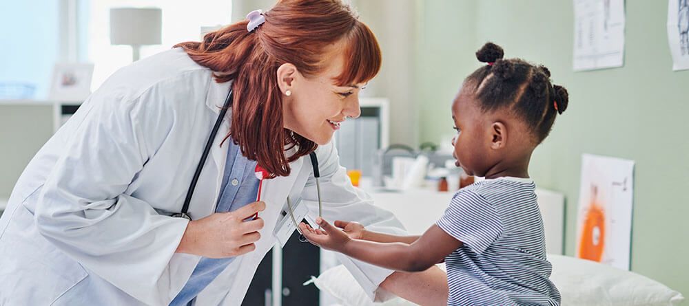 A doctor examines an infant child during a checkup