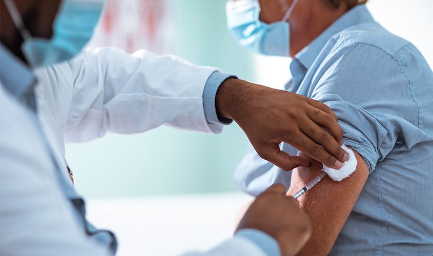 Close-up shot of a doctor giving a vaccine shot for immunization News