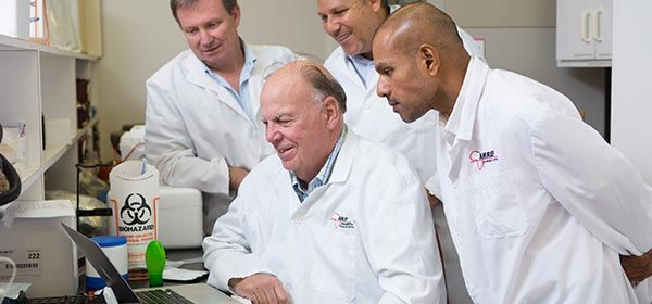 Researchers collaborating in a lab.