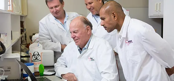 Researchers collaborating in a lab.
